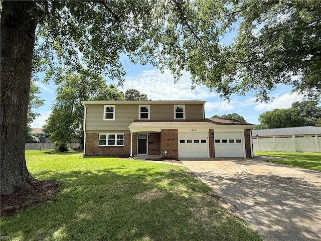 3909 Old Tree Ln, Virginia Beach, VA 23452 - traditional-style house featuring a garage, driveway, and brick siding