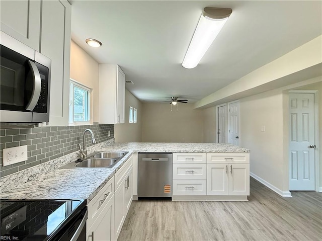 3909 Old Tree Ln, Virginia Beach, VA 23452 - kitchen with stainless steel appliances, light wood-type flooring, a peninsula, white cabinetry, and ceiling fan