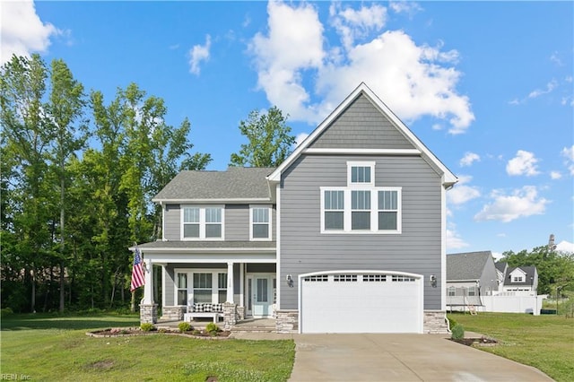 110 Sea Hero Ct, Suffolk, VA 23435 - craftsman house featuring covered porch, an attached garage, concrete driveway, and stone siding