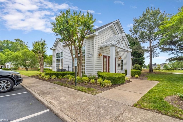 1439 Otterbourne Cir, Chesapeake, VA 23320 - view of property exterior with uncovered parking and a lawn