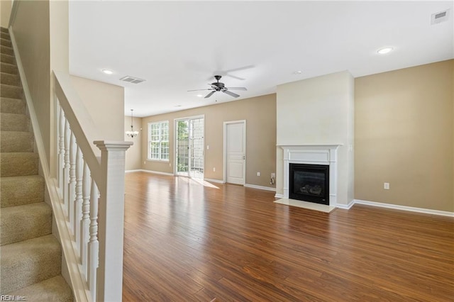 1439 Otterbourne Cir, Chesapeake, VA 23320 - unfurnished living room featuring a fireplace with flush hearth, wood finished floors, stairway, ceiling fan, and recessed lighting