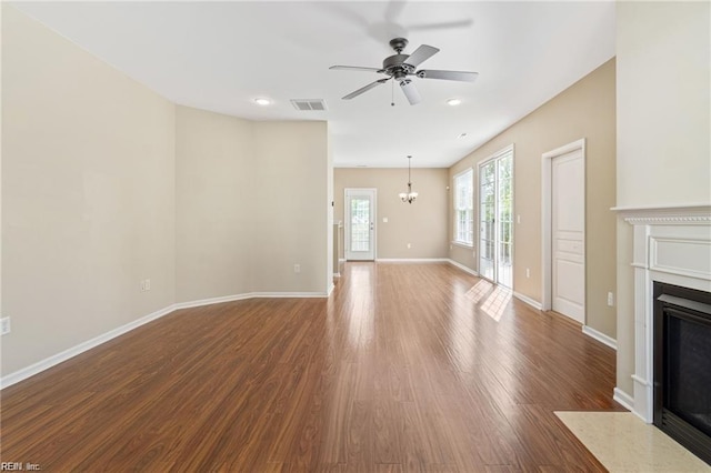 1439 Otterbourne Cir, Chesapeake, VA 23320 - unfurnished living room with a fireplace with flush hearth, ceiling fan, a chandelier, wood finished floors, and recessed lighting