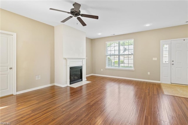 1439 Otterbourne Cir, Chesapeake, VA 23320 - unfurnished living room with wood finished floors, ceiling fan, a fireplace with flush hearth, and recessed lighting