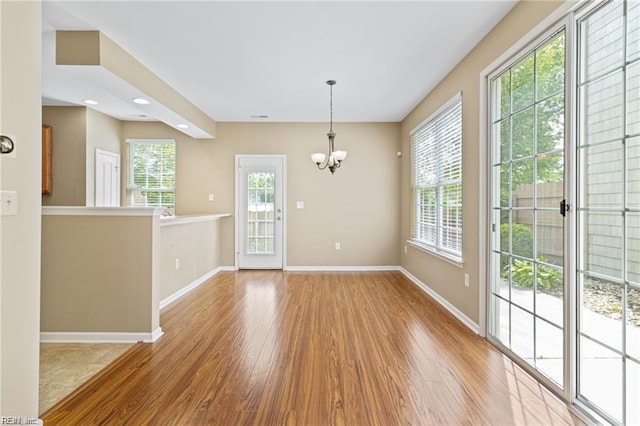 1439 Otterbourne Cir, Chesapeake, VA 23320 - unfurnished dining area with wood finished floors and a chandelier