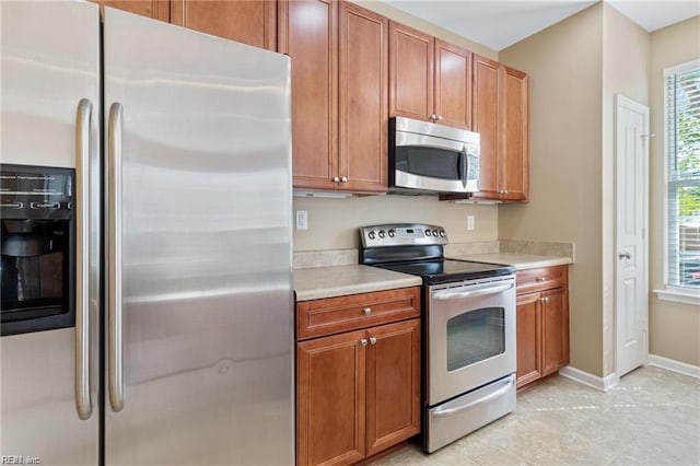 1439 Otterbourne Cir, Chesapeake, VA 23320 - kitchen with appliances with stainless steel finishes, light countertops, and brown cabinets