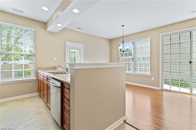 1439 Otterbourne Cir, Chesapeake, VA 23320 - kitchen with stainless steel dishwasher, light countertops, recessed lighting, hanging light fixtures, and a chandelier