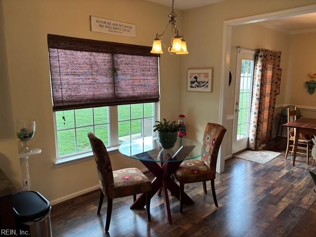 11361 Lena Rose St, Windsor, VA 23487 - dining area with dark wood-style flooring and baseboards