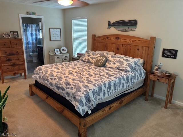 11361 Lena Rose St, Windsor, VA 23487 - bedroom with light carpet, ceiling fan, and connected bathroom
