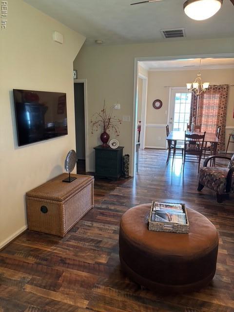 11361 Lena Rose St, Windsor, VA 23487 - living room with a chandelier and wood finished floors