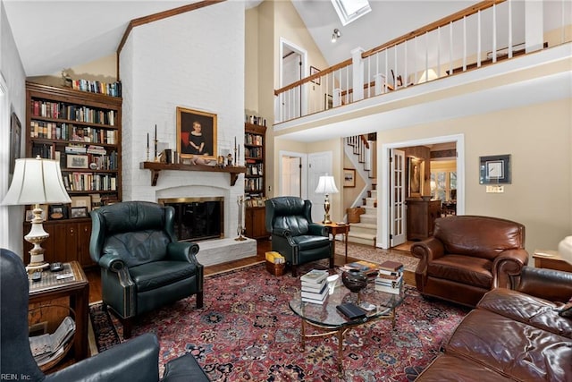 525 Pagan Rd, Smithfield, VA 23430 - living area with a fireplace, stairway, high vaulted ceiling, and a skylight