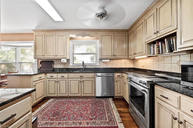 525 Pagan Rd, Smithfield, VA 23430 - kitchen with stainless steel appliances, ceiling fan, decorative backsplash, dark wood-type flooring, and cream cabinetry