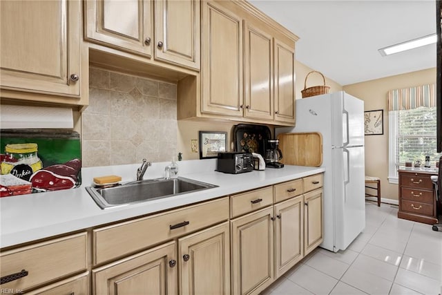 525 Pagan Rd, Smithfield, VA 23430 - kitchen with light countertops, light brown cabinets, tasteful backsplash, and light tile patterned flooring