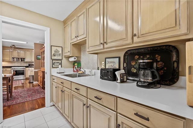 525 Pagan Rd, Smithfield, VA 23430 - kitchen featuring electric stove, tasteful backsplash, light countertops, and cream cabinetry