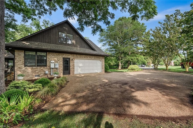525 Pagan Rd, Smithfield, VA 23430 - view of front facade with driveway, brick siding, and a shingled roof