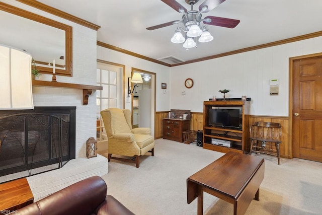 32391 S Main St, Boykins, VA 23827 - living area featuring light carpet, a ceiling fan, ornamental molding, wood walls, and a fireplace