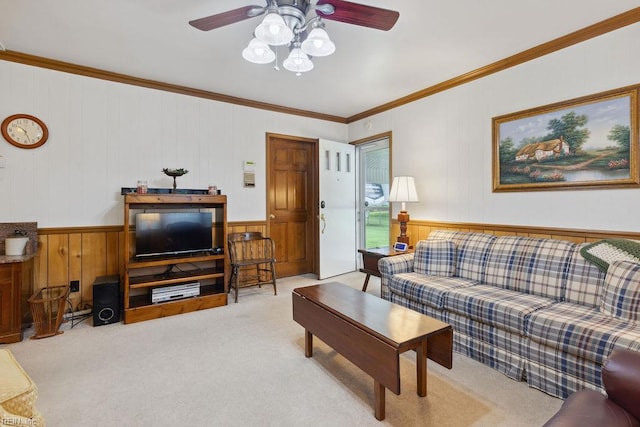 32391 S Main St, Boykins, VA 23827 - living room featuring wood walls, crown molding, carpet flooring, and ceiling fan