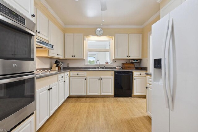 32391 S Main St, Boykins, VA 23827 - kitchen featuring white refrigerator with ice dispenser, black dishwasher, double oven, light wood-type flooring, and dark countertops