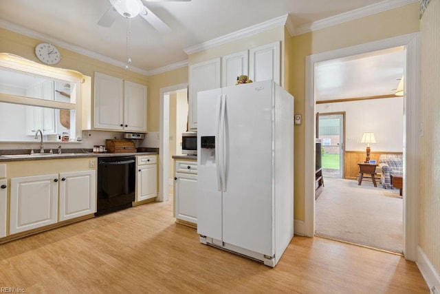 32391 S Main St, Boykins, VA 23827 - kitchen featuring white fridge with ice dispenser, dishwasher, dark countertops, stainless steel microwave, and light wood-type flooring