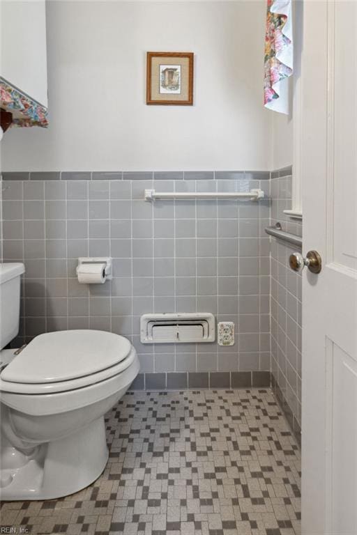 32391 S Main St, Boykins, VA 23827 - half bath featuring tile walls, a wainscoted wall, and tile patterned floors