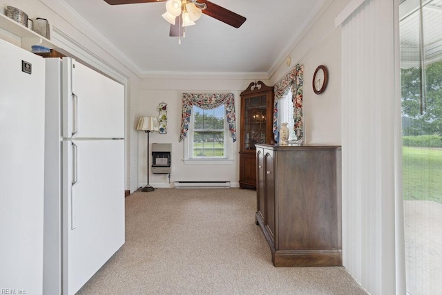 32391 S Main St, Boykins, VA 23827 - kitchen with a baseboard heating unit, freestanding refrigerator, ornamental molding, ceiling fan, and light colored carpet