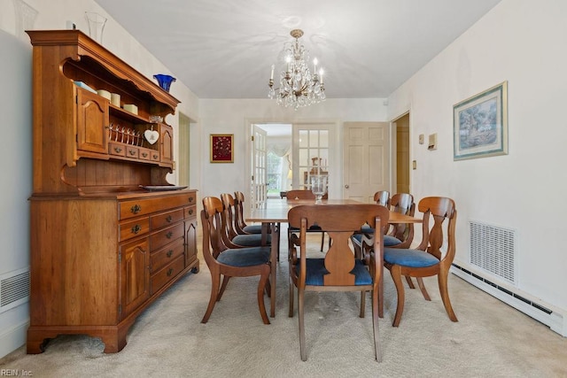 32391 S Main St, Boykins, VA 23827 - dining space featuring light colored carpet, a chandelier, and baseboard heating