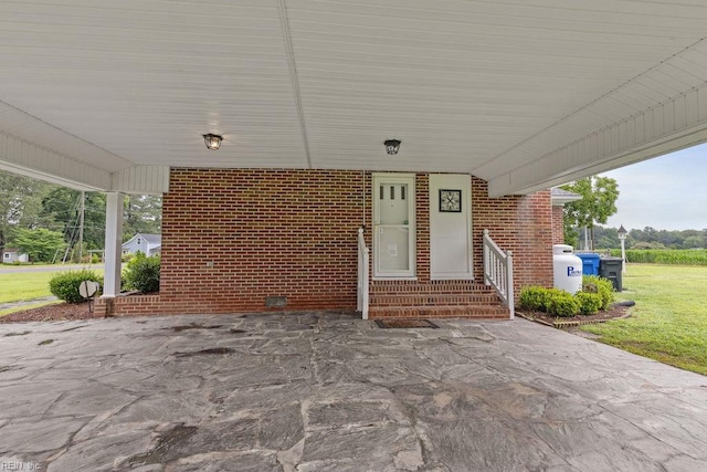 32391 S Main St, Boykins, VA 23827 - view of patio featuring entry steps and a carport