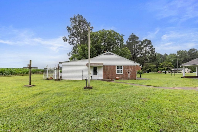 32391 S Main St, Boykins, VA 23827 - back of house featuring a yard and brick siding