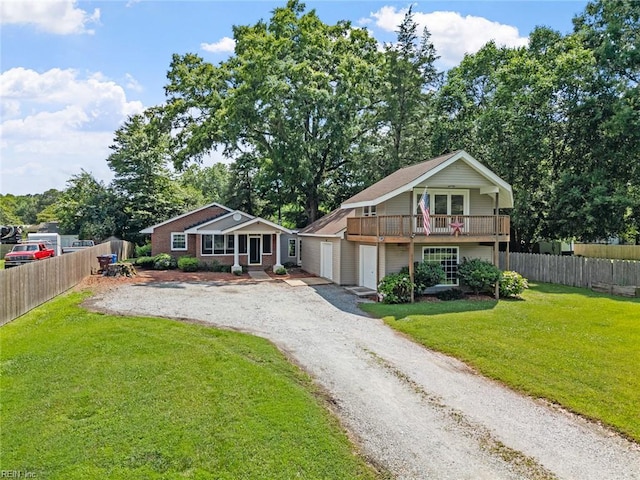 2655 Village Ave, Chesapeake, VA 23323 - view of front facade with gravel driveway, a garage, and a balcony