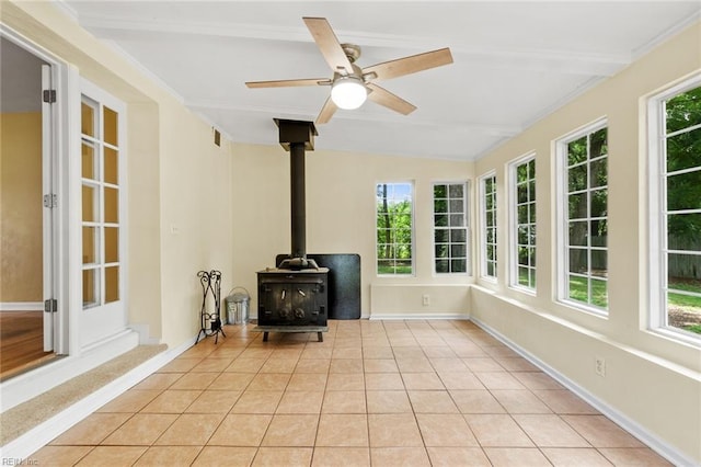 2655 Village Ave, Chesapeake, VA 23323 - sunroom with a wood stove, beamed ceiling, and tile patterned floors