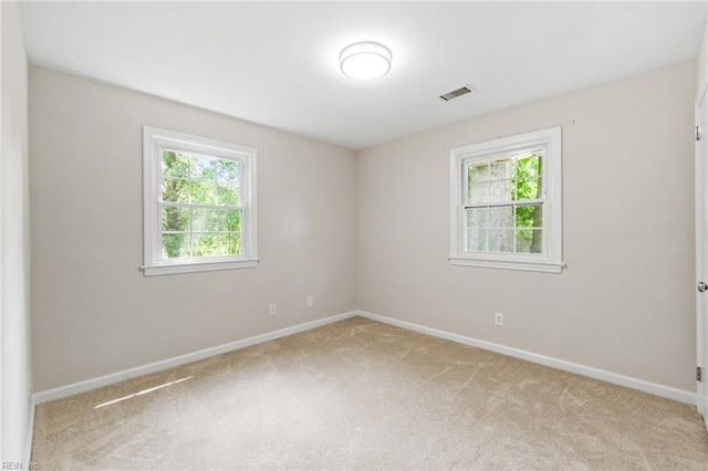2655 Village Ave, Chesapeake, VA 23323 - spare room featuring light colored carpet and baseboards