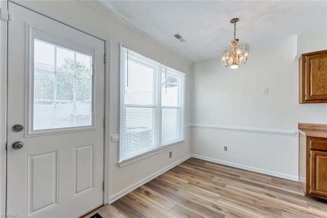 284 Windbrooke Ln, Virginia Beach, VA 23462 - unfurnished dining area with a chandelier and light wood-type flooring