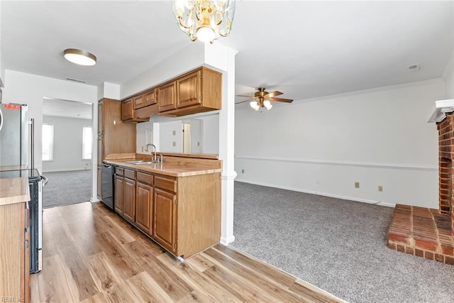 284 Windbrooke Ln, Virginia Beach, VA 23462 - kitchen with freestanding refrigerator, a ceiling fan, light countertops, light wood finished floors, and brown cabinets