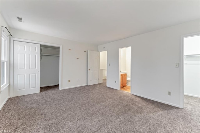 284 Windbrooke Ln, Virginia Beach, VA 23462 - unfurnished bedroom with a closet, carpet, a walk in closet, and ensuite bath