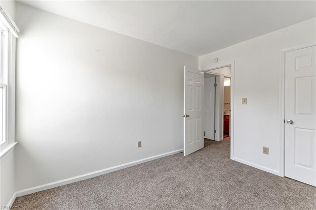 284 Windbrooke Ln, Virginia Beach, VA 23462 - unfurnished bedroom with light carpet and baseboards