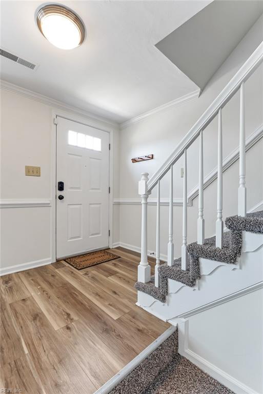 284 Windbrooke Ln, Virginia Beach, VA 23462 - entryway with ornamental molding, stairs, and light wood-style floors