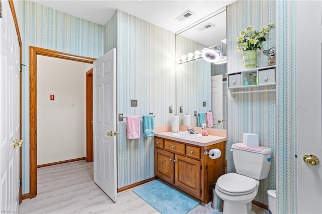 801 Kings Creek Dr, Virginia Beach, VA 23464 - bathroom featuring wallpapered walls, vanity, and wood finished floors