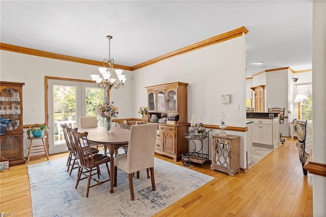 801 Kings Creek Dr, Virginia Beach, VA 23464 - dining room featuring light wood-style flooring, ornamental molding, and a chandelier