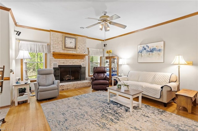801 Kings Creek Dr, Virginia Beach, VA 23464 - living room with ceiling fan, light wood-style floors, ornamental molding, and a brick fireplace