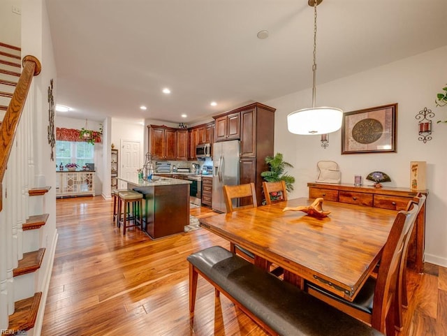 405 Oaktree Rd, Williamsburg, VA 23188 - dining space featuring stairs, recessed lighting, and light wood-type flooring