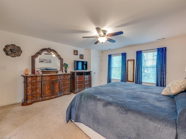 405 Oaktree Rd, Williamsburg, VA 23188 - bedroom with light colored carpet and a ceiling fan