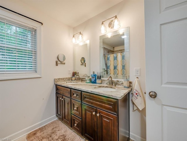 405 Oaktree Rd, Williamsburg, VA 23188 - bathroom with double vanity and a shower with shower curtain