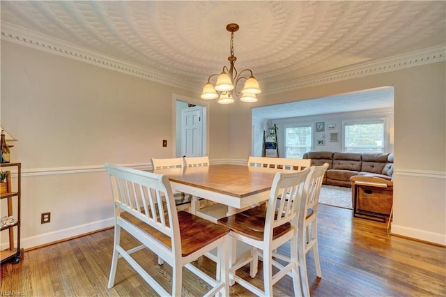2816 Ashwood Dr, Chesapeake, VA 23321 - dining space with a chandelier, ornamental molding, and wood finished floors