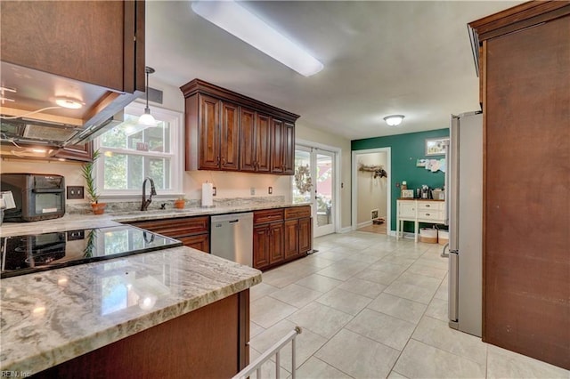 2816 Ashwood Dr, Chesapeake, VA 23321 - kitchen featuring stainless steel appliances, light stone counters, plenty of natural light, and light tile patterned floors