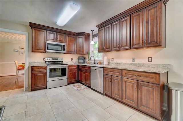 2816 Ashwood Dr, Chesapeake, VA 23321 - kitchen with appliances with stainless steel finishes, light stone counters, hanging light fixtures, and light tile patterned floors