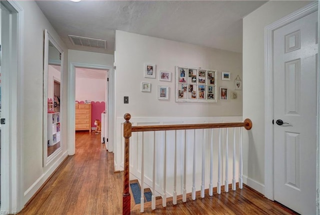 2816 Ashwood Dr, Chesapeake, VA 23321 - corridor with wood finished floors and an upstairs landing