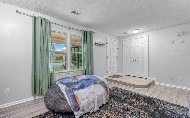 1109 Evert Dr, Virginia Beach, VA 23464 - bedroom featuring wood finished floors and a textured ceiling