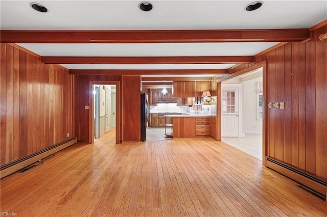 116 Crittenden Ln, Newport News, VA 23606 - unfurnished living room with a baseboard radiator, beam ceiling, light wood finished floors, and wood walls