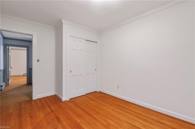 116 Crittenden Ln, Newport News, VA 23606 - unfurnished bedroom featuring light wood-type flooring, crown molding, and a closet