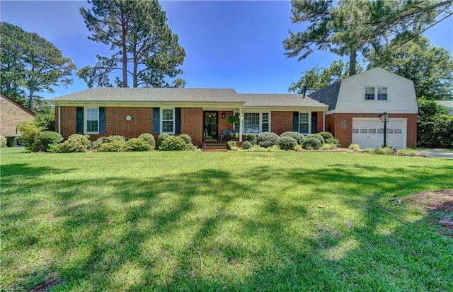 3808 Shoreline Dr, Portsmouth, VA 23703 - view of front of house with brick siding, a front yard, and a garage