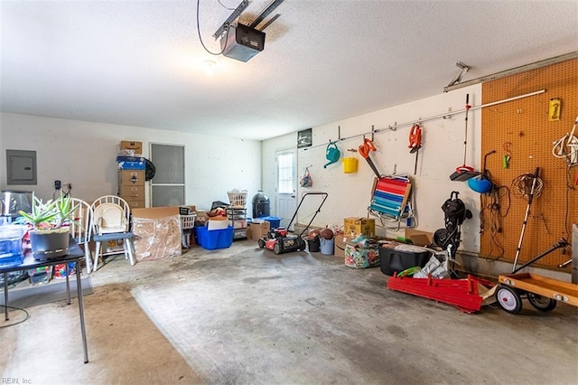 13 Fawn Cir, Hampton, VA 23666 - garage with electric panel, a garage door opener, and a workshop area